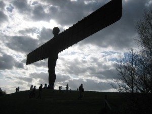 The Angel of the North stands tall outside Gateshead, rooted into the hillside, a reminder of past industry and a challenge to future care and compassion for land and people.